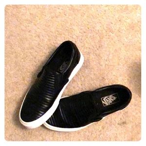 Vans black leather slip ons